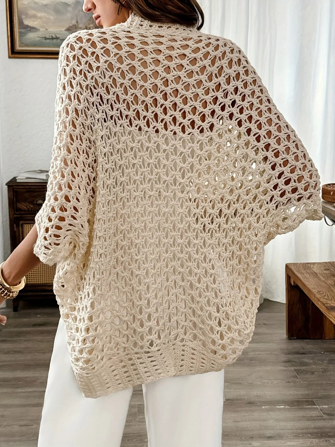 Casual women's short sleeve open knit cardigan. Drape front design, great for layering over summer outfits.