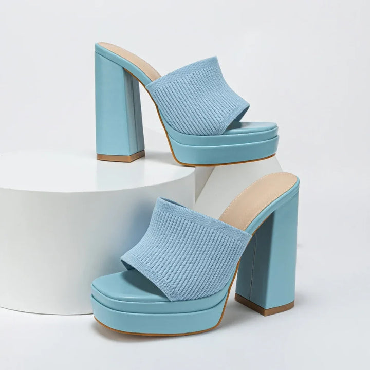 Close-up of women's open-toe platform heeled sandals showcasing chunky heel, platform, & adjustable strap detail.