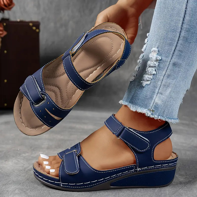 Close-up of women's open toe platform sandals, highlighting the secure ankle strap and stylish platform heel.