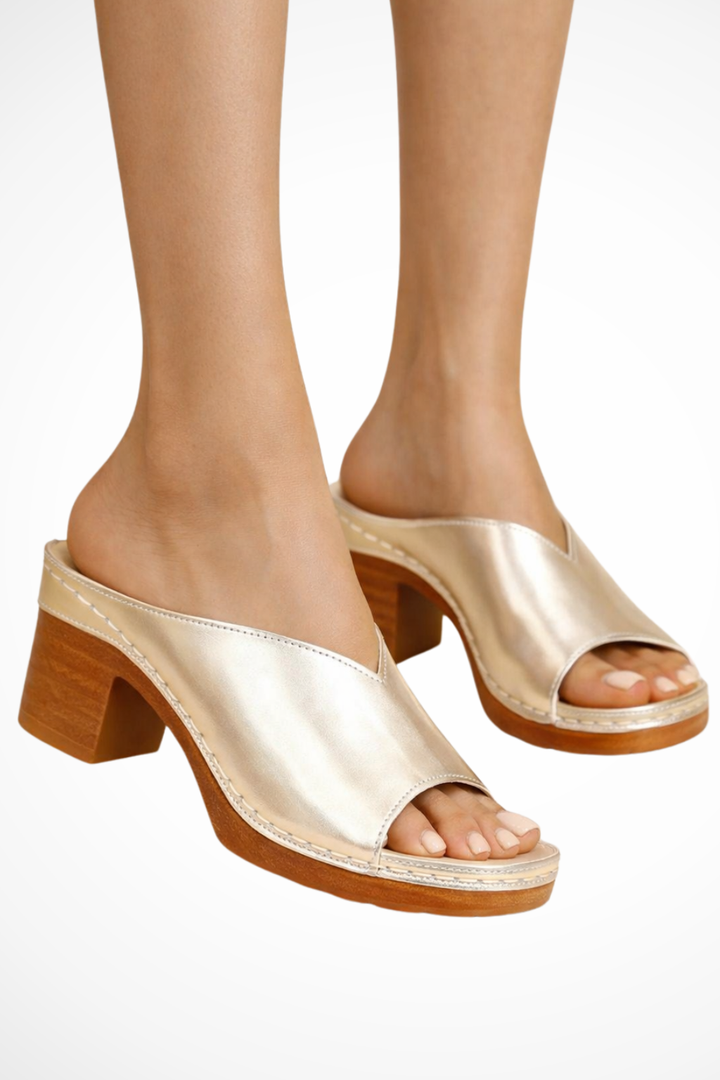 Close-up of a women's open toe slip-on mule showing the elegant block heel & comfortable design.