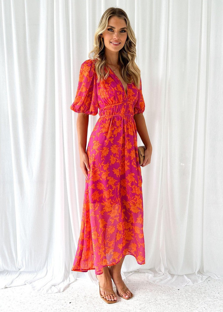 Stylish women's orange floral long sleeve midi dress. Formal V-neck design, elegant autumn wedding guest or party dress.