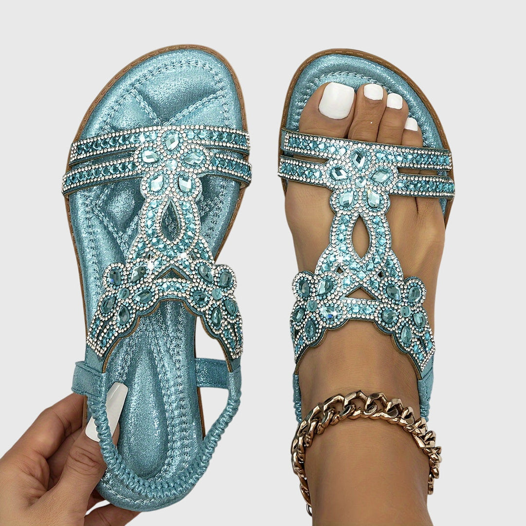 Elegant women's orthopaedic sandals for comfort & support, adjustable back strap design.