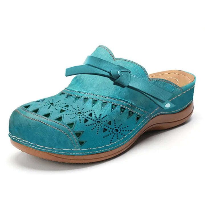 Casual women's orthopaedic comfort shoes, perforated strap clogs with arch support for walking.
