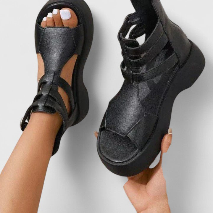 Supportive women's platform sandals with orthopaedic foot support. Multi-strap, zip closure, & buckle for casual style.