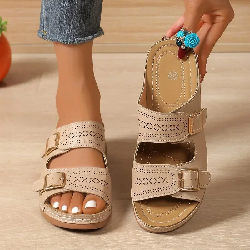 Black slip-on orthopaedic sandals for women, offering pain relief & arch support. Ideal comfort walking footwear.