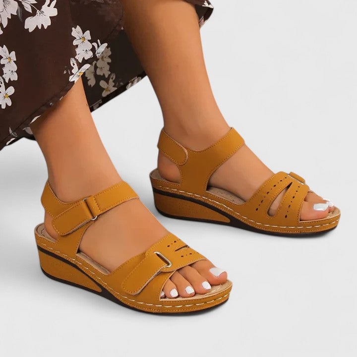 Comfortable women's orthopaedic sandals featuring arch support and cushioned sole for all-day foot relief.