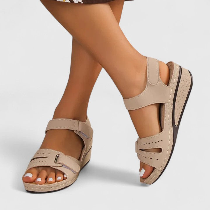 Stylish women's orthopaedic sandals with arch support, providing comfort and foot pain relief for summer.