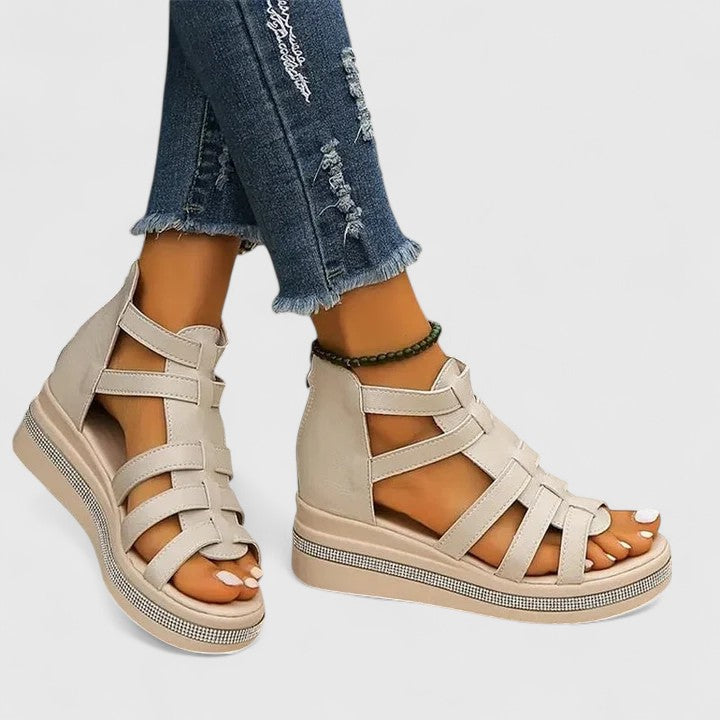 Stylish orthopaedic women's sandals featuring elegant strass detailing & a supportive wedge heel.