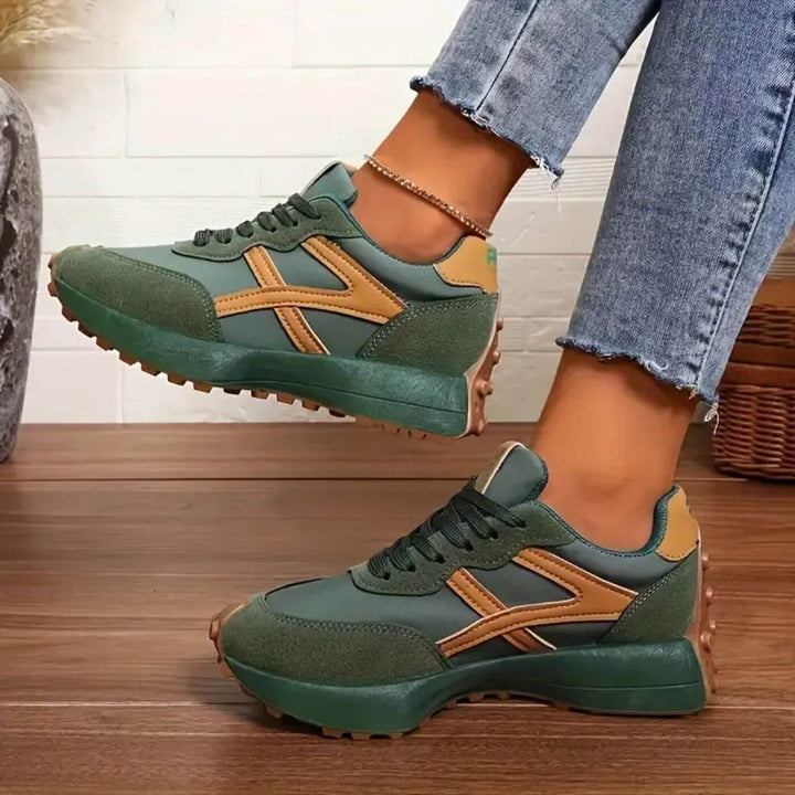 Lace-up women's orthopaedic trainers featuring a unique panel design. Provides excellent support for all-day comfort.