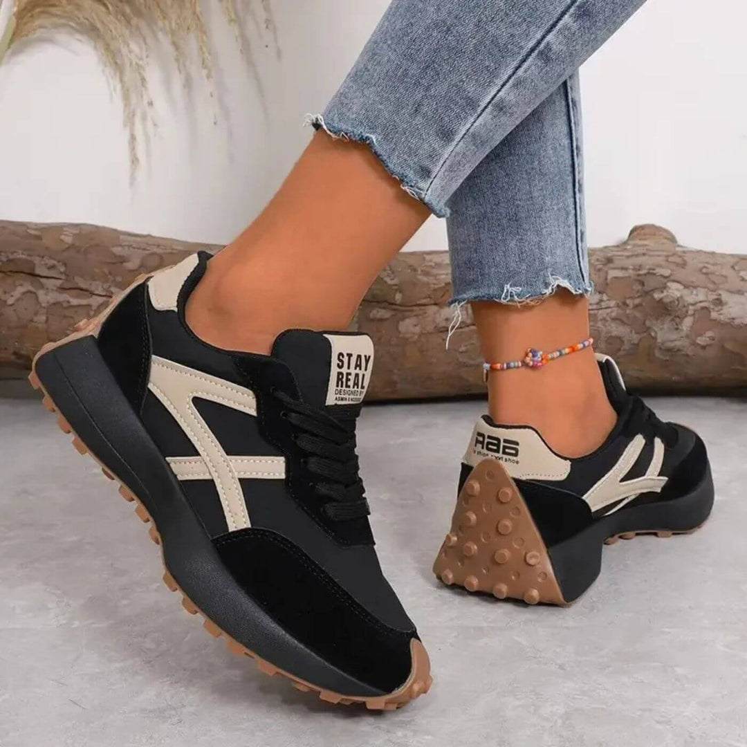 Women's athletic orthopaedic support trainers. These comfortable lace-up sneakers feature a stylish panel design for active women.
