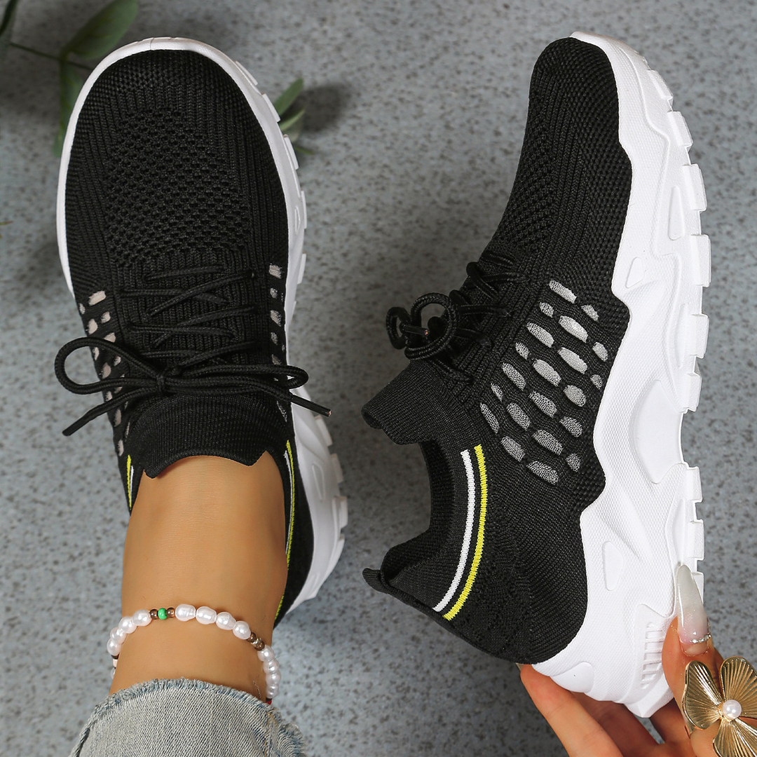 Supportive women's walking sneakers with shock-absorbing ergonomic design.