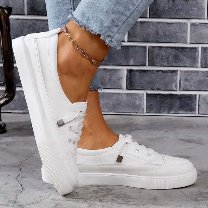 Supportive women's sneakers with arch support, cushioned sole, and slip-resistant design for daily walking comfort.