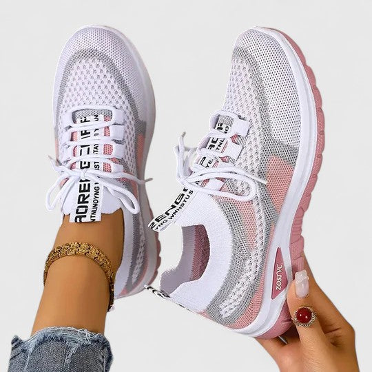 Close-up of breathable mesh women's trainers, designed for joint pain relief and comfort.