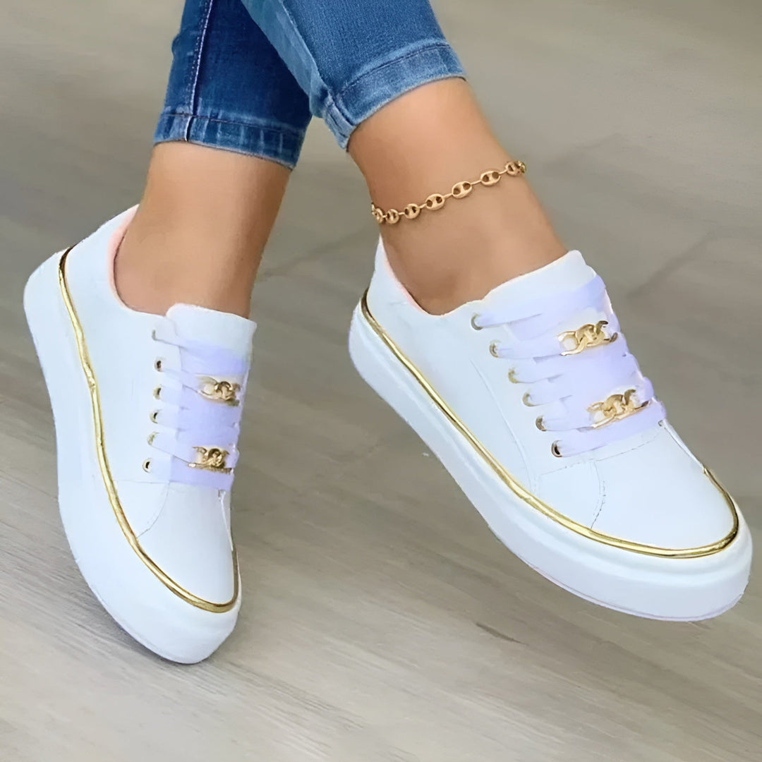 Women's orthopaedic trainers with chic golden accents, offering arch support & comfort for stylish daily wear.