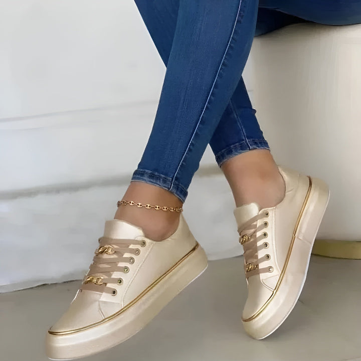 Orthopaedic women's sneakers with golden embellishments, providing comfort & excellent arch support for active women.