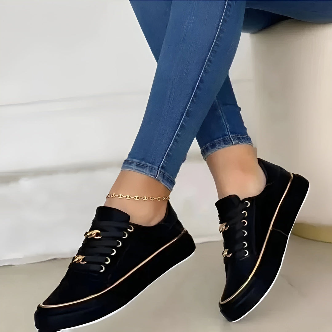 Fashionable women's orthopaedic trainers with stylish golden accents, ensuring comfortable arch support for all-day wear.