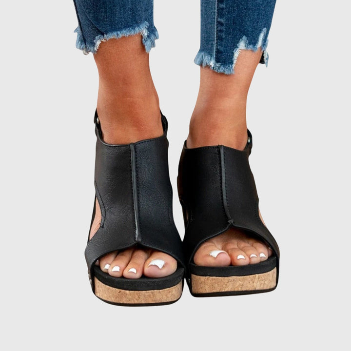 Close-up of comfortable women's orthopaedic wedge sandal, highlighting adjustable strap detail.