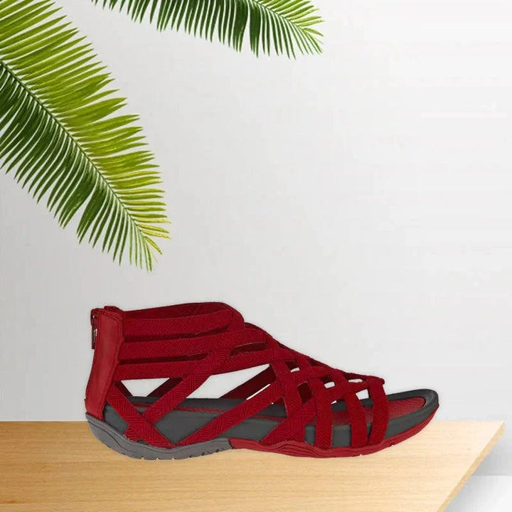 Elegant summer women's orthopedic sandals, adjustable caged style, secure zip for versatile wear.