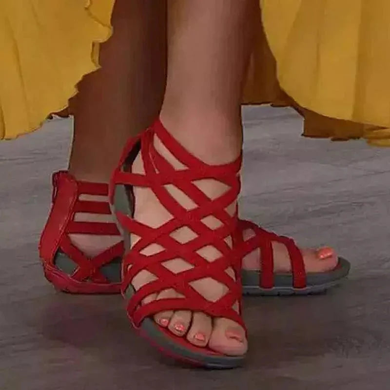 Women's black orthopedic caged sandals featuring adjustable straps, zip closure, and arch support.