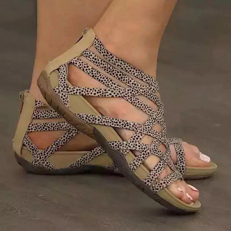 Fashionable women's orthopedic sandals with adjustable straps, elegant caged design, and easy zip.
