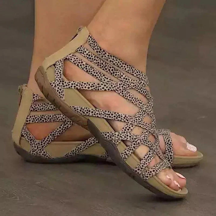 Fashionable women's orthopedic sandals with adjustable straps, elegant caged design, and easy zip.