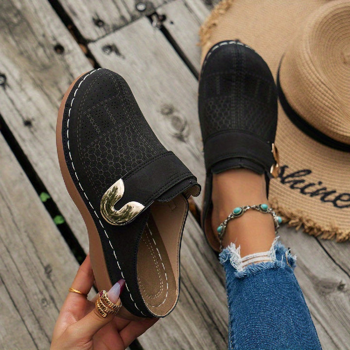 Women's orthopedic arch support slippers. Cushioned for comfort & foot relief. Non-slip sole for indoor safety.