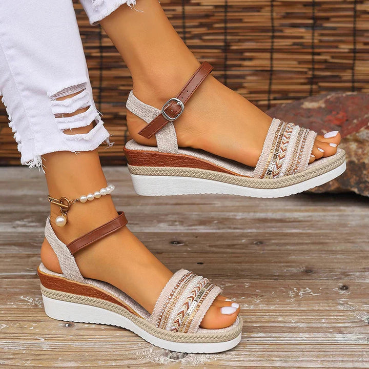 Women's orthopedic beige wedge sandals with arch support, comfortable ankle strap, and open toe for summer.