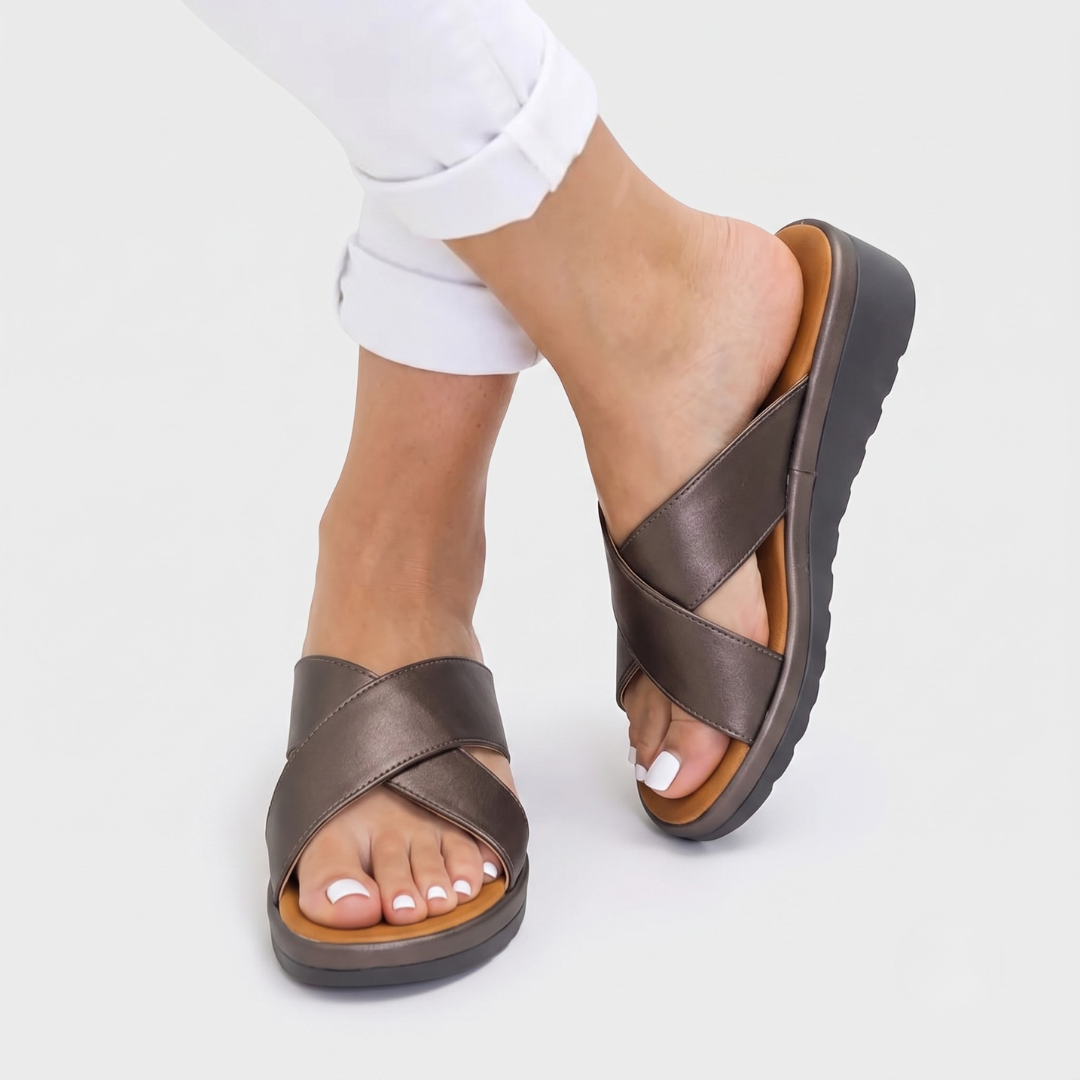 Supportive women's orthopedic cross-strap sandals. Comfort footwear, ideal slip-on summer shoes.