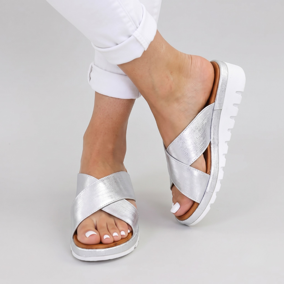 Women's orthopedic comfort cross-strap summer sandals. Stylish slip-on footwear for walking.