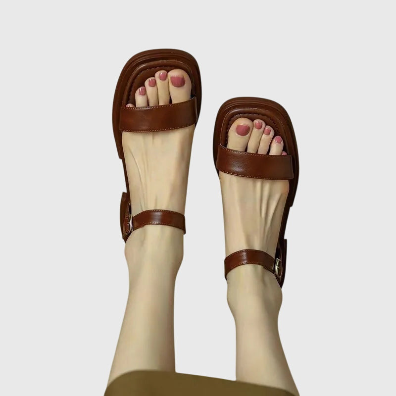 Women's orthopedic comfort sandals with supportive block heel, perfect for casual summer wear. Stylish slip-on footwear.