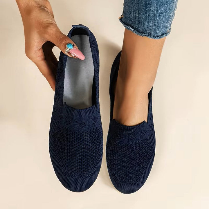 Woman wearing comfortable orthopedic walking shoes with excellent arch support for long strolls.