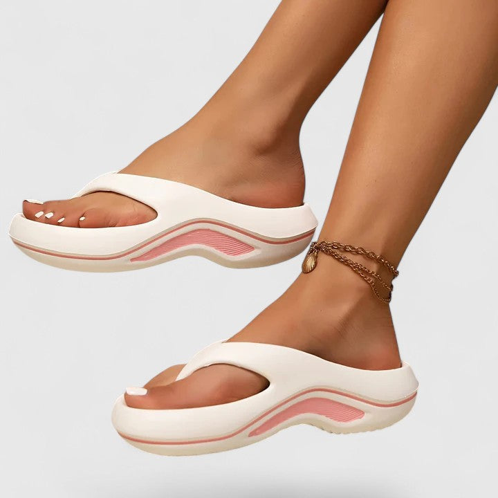 Lightweight women's slide sandals, ergonomic design for summer comfort and arch support.