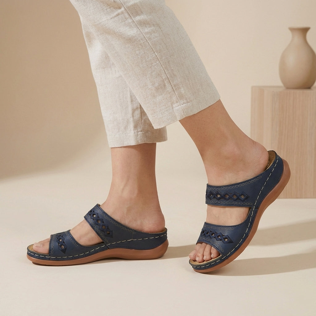 Experience all-day comfort with these women's orthopedic slides, featuring supportive double straps.