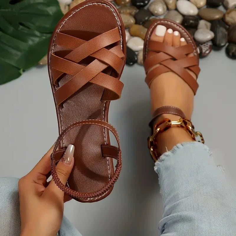 Women's orthopedic criss-cross sandals with adjustable ankle strap for comfort & support.