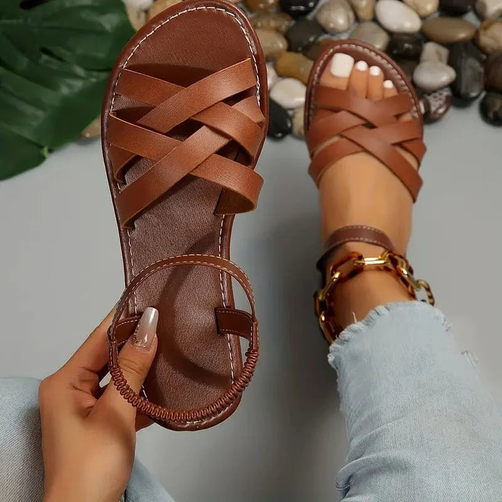 Women's orthopedic criss-cross sandals with adjustable ankle strap for comfort & support.