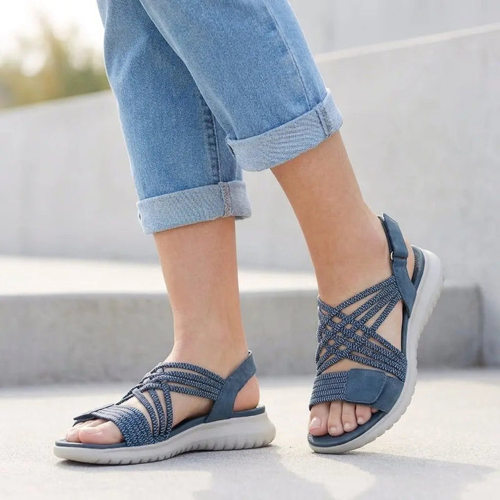 Supportive women's orthopedic sandals. Criss-cross design with arch support & adjustable comfort for foot health.