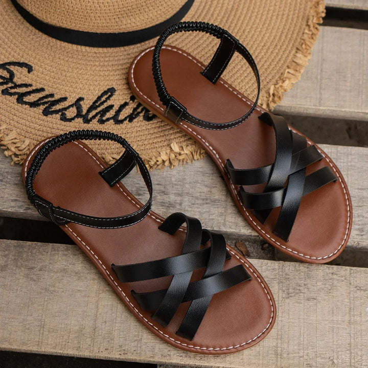 Comfortable women's orthopedic sandals, criss-cross design with adjustable ankle strap for superior support.