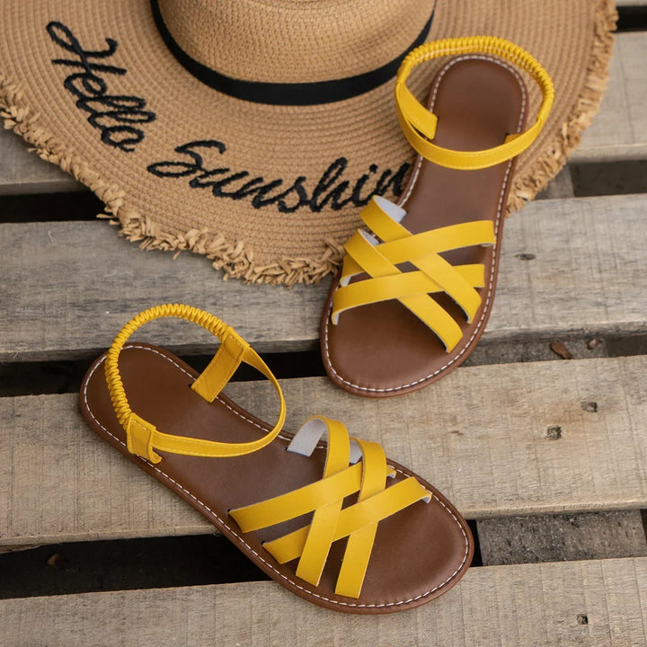 Criss-cross strap women's orthopedic sandals featuring an adjustable ankle strap for a secure, comfortable fit.