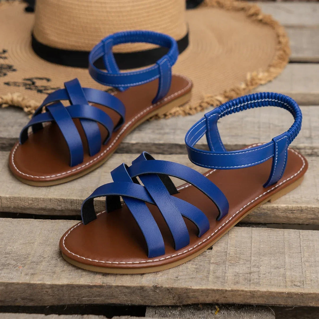 Supportive orthopedic women's sandals, criss-cross straps & adjustable ankle strap for comfortable walking.
