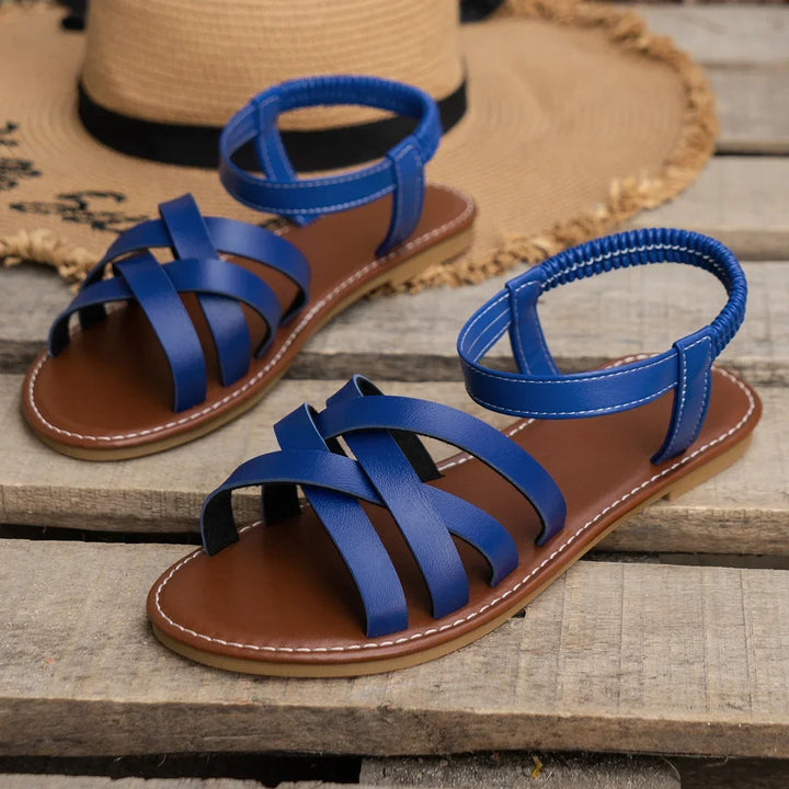 Supportive orthopedic women's sandals, criss-cross straps & adjustable ankle strap for comfortable walking.