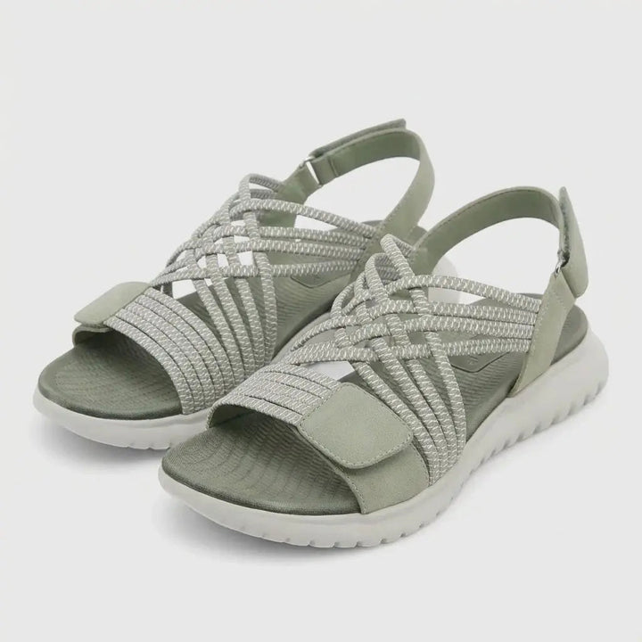 Women's adjustable orthopedic criss-cross sandals. Comfortable footwear with arch support for daily wear.