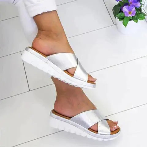 Supportive women's orthopedic cross strap sandals for all-day comfort, foot health, and casual wear.