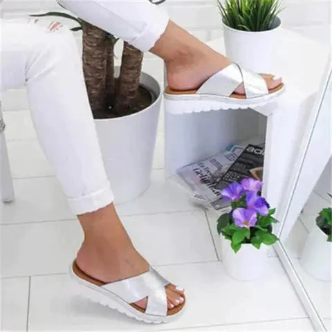 Stylish slip-on women's cross strap orthopedic sandals, designed for summer comfort and walking support.