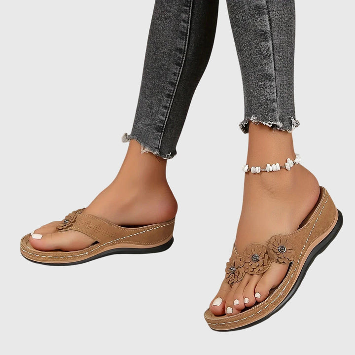 Relieve foot pain with women's orthopedic flip flops, providing superior arch support and lasting comfort.