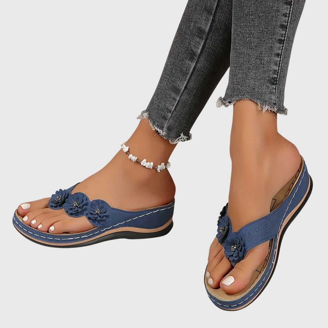 Women's comfortable orthopedic flip flops designed for arch support & relief during long summer days.