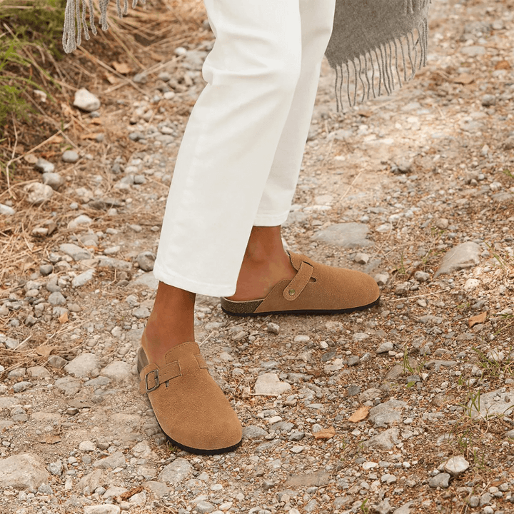 Comfortable women's orthopedic slip-on slippers for indoor/outdoor use, offering excellent foot support.