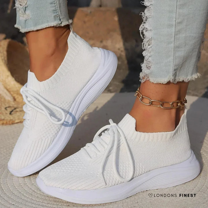 Women's orthopedic lace-up sneakers with sock-like ankle support, ideal for comfortable walking and foot support.