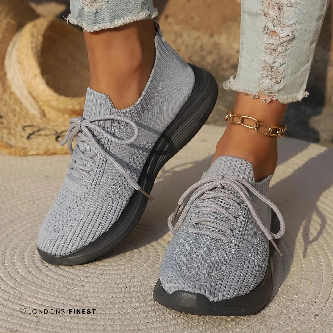 Comfortable women's orthopedic walking sneakers with arch support, lace-up design, and sock-like ankle for everyday wear.