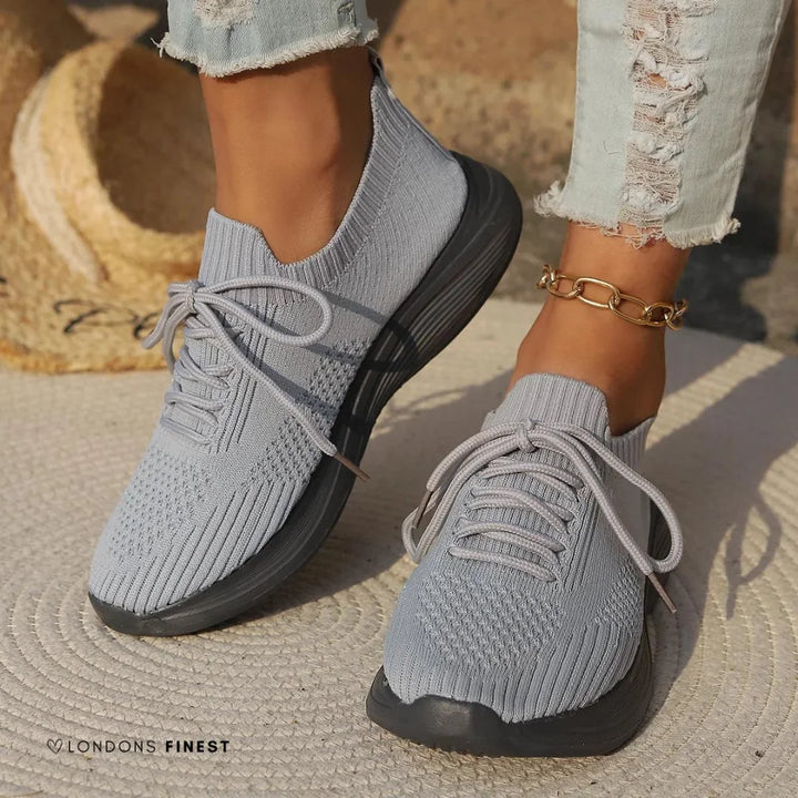 Comfortable women's orthopedic walking sneakers with arch support, lace-up design, and sock-like ankle for everyday wear.