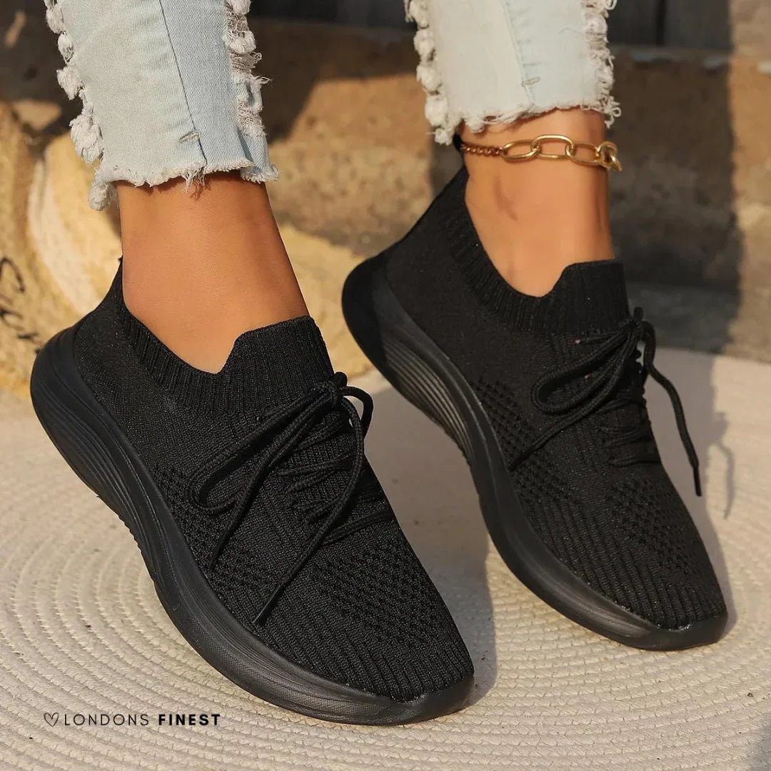 Stylish women's casual orthopedic sneakers, featuring lace-up closure, sock-like ankle, and excellent foot support for walking.